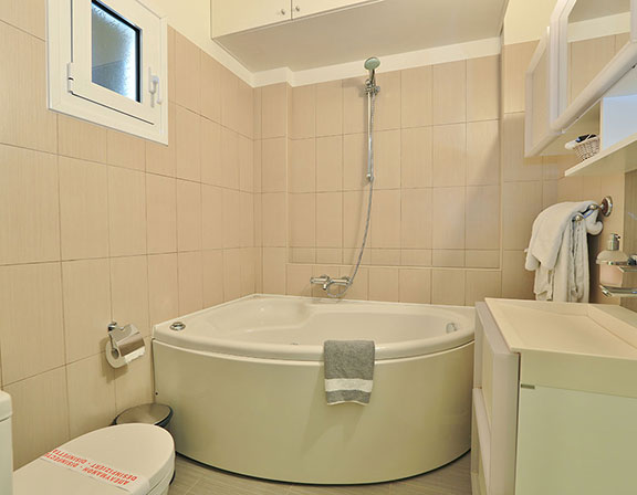 Bathroom with bathtub at the apartment