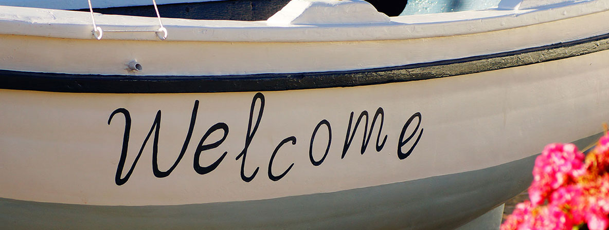 Traditional wooden boat at the entrance of the hotel